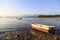 The boat stays on a stone beach