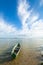 Boat on summer lake bank