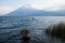 Boat during sunset at Lake Atitlan at the shore of San Marcos, Guatemala