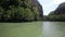 Boat swims in the lagoon with blue water