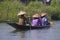 Boat with three peoples on Inle Lake.