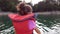 Boat tour baby girl children with life jacket on the lake at sunset