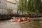 Boat of tourists travelling down the river in the city of Bruges, Belgium.