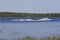 Boat Tows Waterskier on Bass Lake  703469