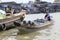 A boat travels through a floating market on the Mekong river in Viet Nam