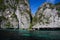 Boat trip around impressive steep rough cliffs of tropical island Ko Phi Phi, Thailand