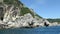 Boat trip from Paleokastritsa towards Liapades beach at Corfu Island Greece. passing by sediment chalk rocks in the water. Cliff