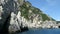 Boat trip from Paleokastritsa towards Liapades beach at Corfu Island Greece. passing by sediment chalk rocks in the water. Cliff