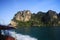 Boat Trip to  islands along steep cliffs in blue Andaman Sea near Ao Nang, Krabi, Thailand