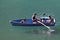 Boat trips on the majestic Swiss lakes. Father and son in a boat in a lake. Lake in Switzerland