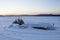 Boat under snow. Lake Zyuratkul. Ural winter landscape