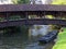 Boat under wooden bridge idyllic scenery at spring