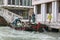 Boat with Venice public utilities workers on the pier