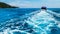 Boat Wake Prop Wash in Clear Blue Ocean Sea from Behind of Soft Focus Speed Boat