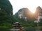 The boat that was paddling along the waterway with high mountains