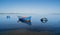 Boat in the water. Fishing boat in the calm waters of the pond of santa caterina in southern sardinia