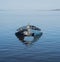 Boat in the water. Fishing boat in the calm waters of the pond of santa caterina in southern sardinia