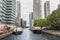 Boat in water with modern buildings in Canary Wharf