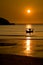 Boat on water at sunset, Porth Beach, Cornwall, England