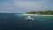 Boat in white beach in Moalboal, Cebu, Philippines. Beautiful Landscape with Seashore and People in Background