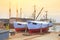 Boat with workers in a boatyard being repaired