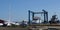 Boat yard outside, many small white boats in for repair or sale