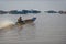 Boater in river at Tonle Sap, Cambodia