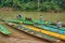 Boaters carry passengers on a small river. Laos, Luang Prabang