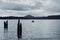 Boaters on Lake Quinault on an overcast, moody day