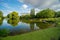 Boaters on small lake at park, Birmingham, England