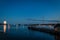 Boathouse and docks in the harbor with fireworks setting off