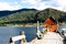 Boathouse at the end of a pier on the river with a view of beautiful