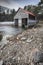 Boathouse on frozen Loch Vaa in the Cairngorms National Park of Scotland.