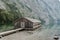 Boathouse with jetty at lake Obersee, Germany