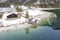 Boathouse next to wonderful clear green blue water at lake plansee