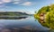 Boathouse reflections at lake.