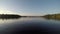 Boating Across The Smooth Water of Rainey Lake