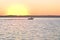 Boating as Sun rise`s at Lake Fort Phantom near Abilene Texas.