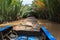 Boating on a dirty river Mekong Delta, Vietnam