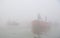 Boating on Ganges River with dense fog