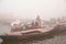 Boating on Ganges River with dense fog