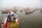 Boating on Ganges River with dense fog