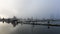 Boating harbor and jetty on a misty morning