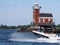 Boating past Stepping Stone Lighthouse on a beautiful day