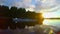 Boating on river at sunset, people having rest after rowing