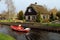 Boating trip in a canal in Giethoorn.