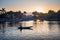 A boatman ferries tourists along the Halong Bay on land tourist attraction in Tam Coc, Vietnam.