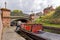 Boatman manoeuvring a Narrowboat, Dudley, West Midlands.