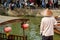 Boatman with paddle near traditional tourist boat on canal of Shanghai Zhujiajiao Old Town in Shanghai, China. Chinese Venice