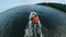 A boatman riding his boat on river.